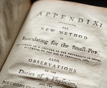 Detail of a printed book shows text in English reading "Appendix" at the top of the page.