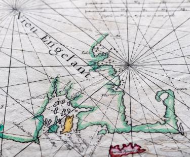 Detail of a colored engraved map shows latitude and longitude lines and label in English over New England written as "Nieu Engelant."