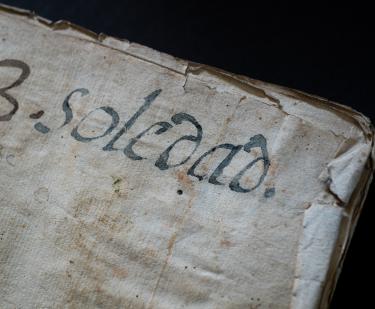 Detail from the binding of a manuscript codex shows text in Spanish "3. Soledad."