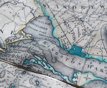Detail of an engraved, colored map of Jamaica shows Kingston Harbor outlined in a greenish blue color and St. Andrew. Other surrounding locations labeled in English.