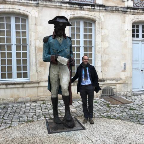 John Carter brown library director Neil Safier next to statue of toussaint louverture