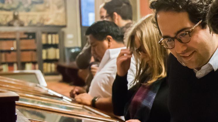 JCB Fellow Juan Cobo Betancourt views an exhibition at the John Carter Brown Library