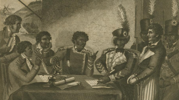 A group of men dressed in military uniform sit around a table, surrounded by soldiers carrying muskets who stand behind a white prisoner. One man is writing on a piece of parchment on the table.
