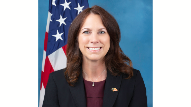 The image shows a formal photograph of Colleen Shogan.