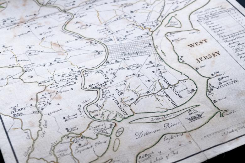 Detail of hand colored, engraved map of Philadelphia, Pennsylvania shows roads, rivers, settlements, and ships. Text in English labels features such as townships, the Delaware River, and West Jersey.