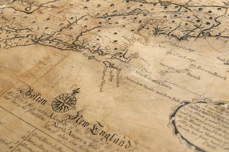 Detail of an engraved map of northeastern North America shows a large compass rose and labels in English for landmarks.