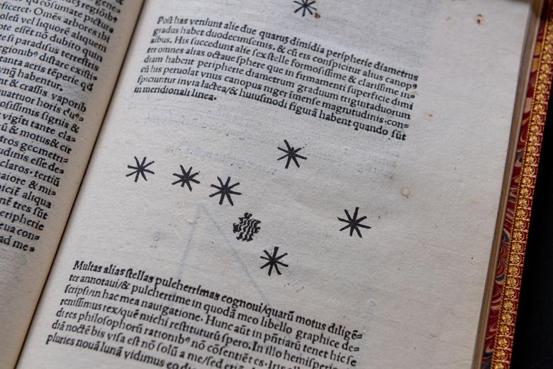 A cluster of stars, possibly a constellation, and text in Latin. 
