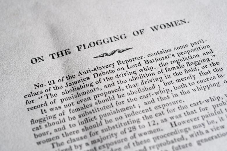 Detail of printed document shows title "On the flogging of women" and other text in English.