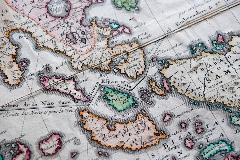 Detail of a pink, orange, and blue colored, engraved map shows islands of Philippines such as "Masbate" and "Ticao." Other details include a line partially labelled "de la Nao para la Nueva Espanna."