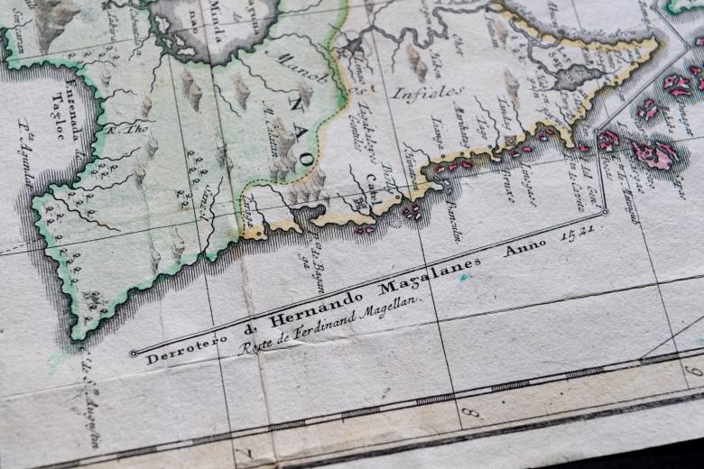 Detail of a  colored, engraved map of the Philippines shows mountains and text in Spanish such as "Manobos Infieles." Other details include a label reading "Derrotero d. Hernando Magalanes Anno 1552."