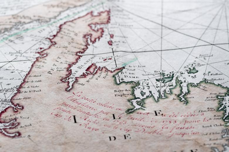 Detail of a hand colored printed map shows text in French to label geographic locations of importance.