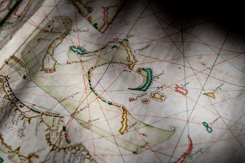Detail of a colored manuscript map shows islands labeled in Spanish.