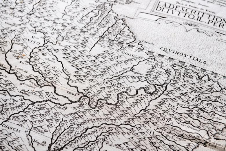 Detail of an engraved map shows mountainous topography and text in Italian reading "La Nova Andalucia," "Le Amazone," and "Terra del Brasil" among other labels.