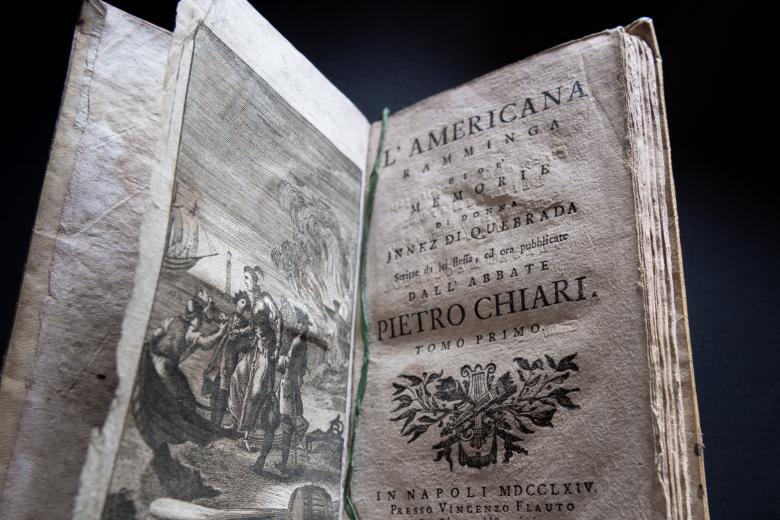 Detail of a printed book shows the title page of L'Americana Ramminga. Includes a frontispiece illustration, text in Italian, and a decorative flourish.