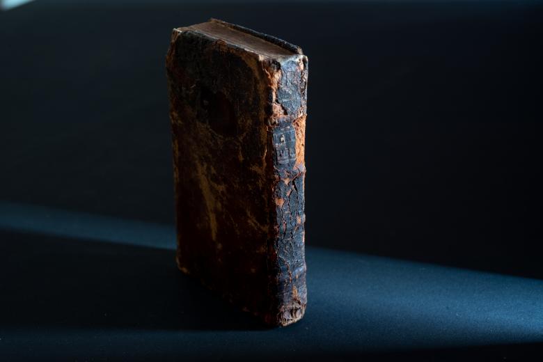 The spine and back cover of Lettre d'une Peruvienne shows deteriorated calf binding. 