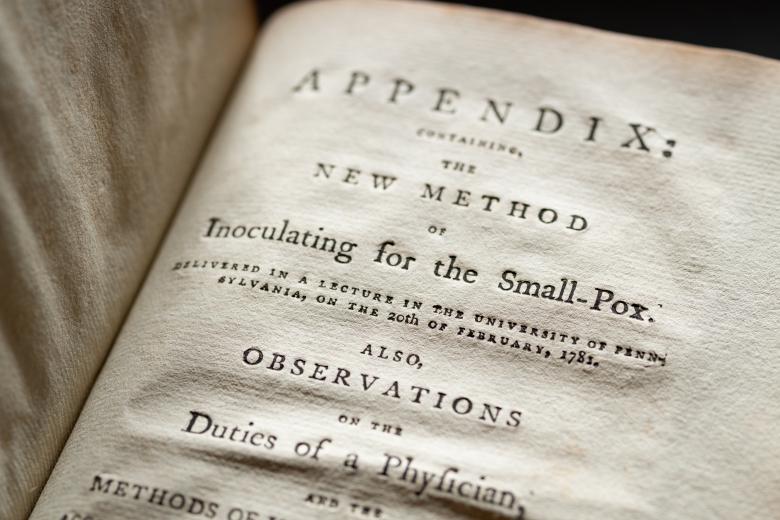 Detail of a printed book shows text in English reading "Appendix" at the top of the page.