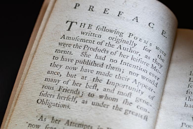 Detail of a printed text shows text in English reading "Preface" at the top of the page.
