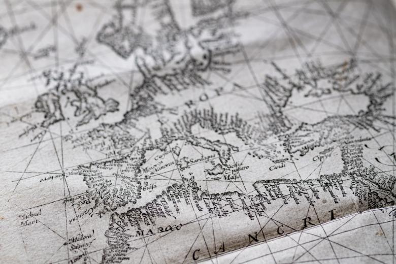 Detail of fold-out engraved map shows Europe labeled "Evropa," Morocco labeled "Maroco," and the Tropic of Cancer written as "Cancri."