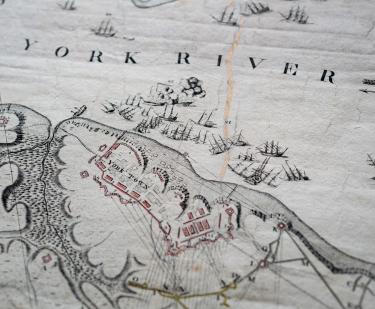 Detail of an engraved, hand colored map shows naval warfare, labels over "York River" and "York Town," and red and yellow details.