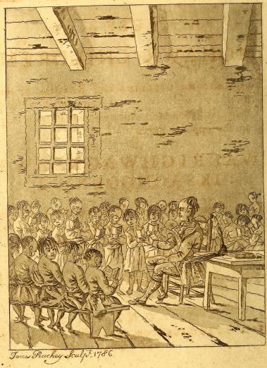 a Mohawk man teaches children in a schoolhouse