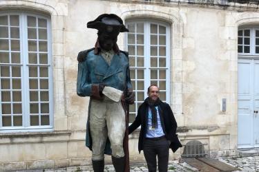 John Carter brown library director Neil Safier next to statue of toussaint louverture